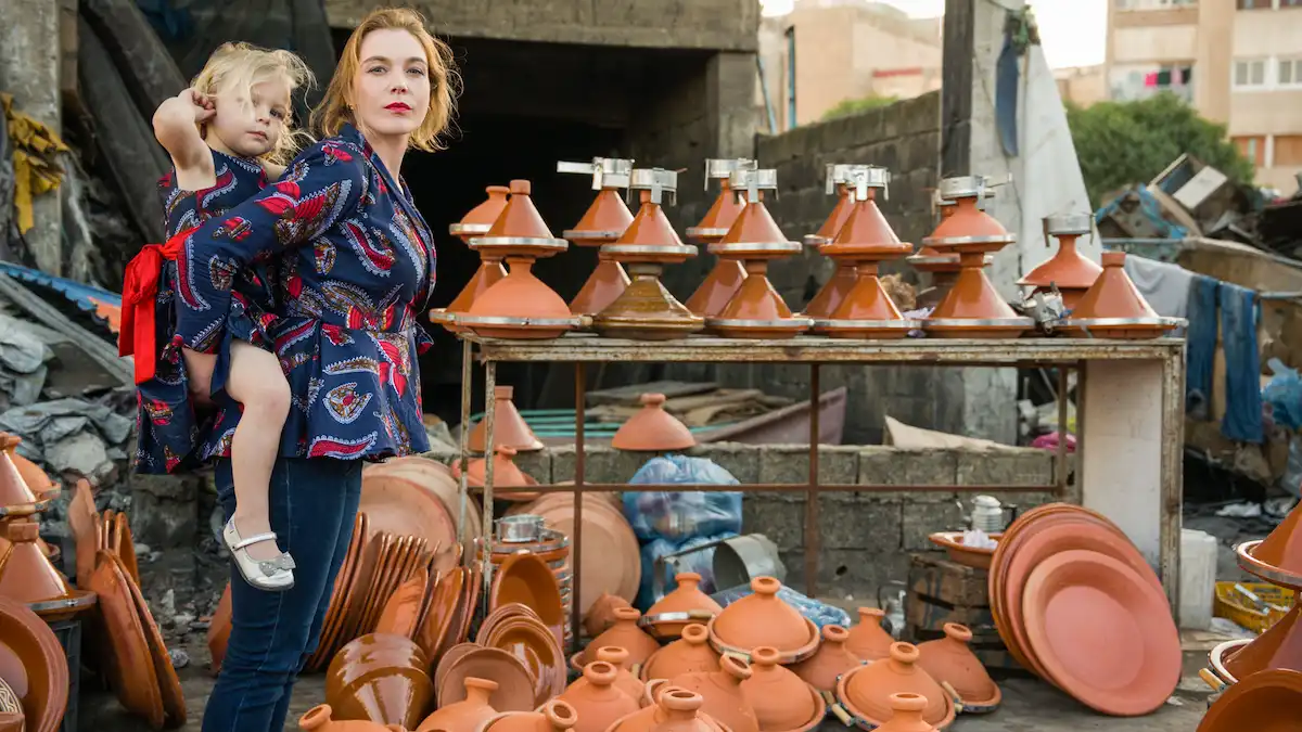 blonde women with her kid in a tajine shop in the old medina of casablanca morocco; best time to visit morocco; 