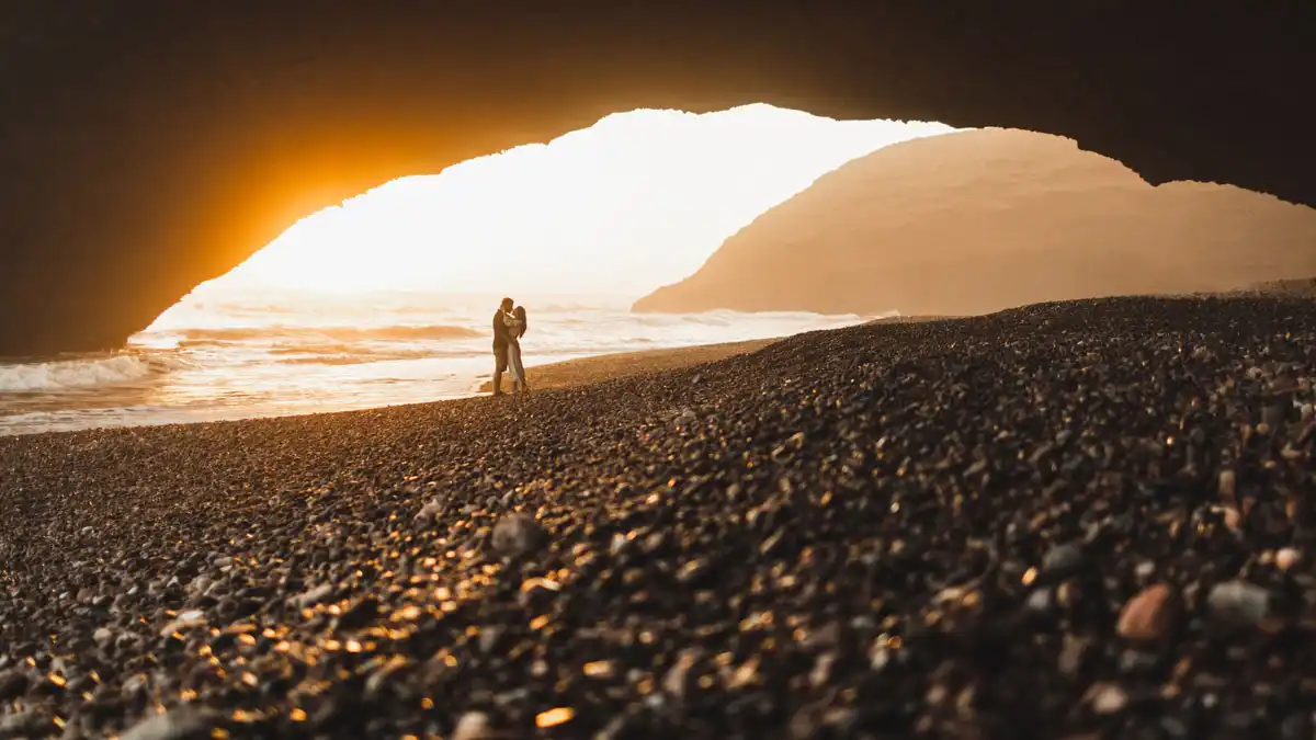 10 Best Places To Visit In Morocco - Travel Guide a couple enjoying the sunset at the beach in Agadir
