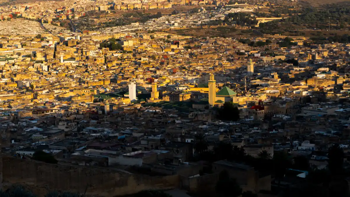 What is the City of Fez Famous For panoramic view of fez old medina during sunset;