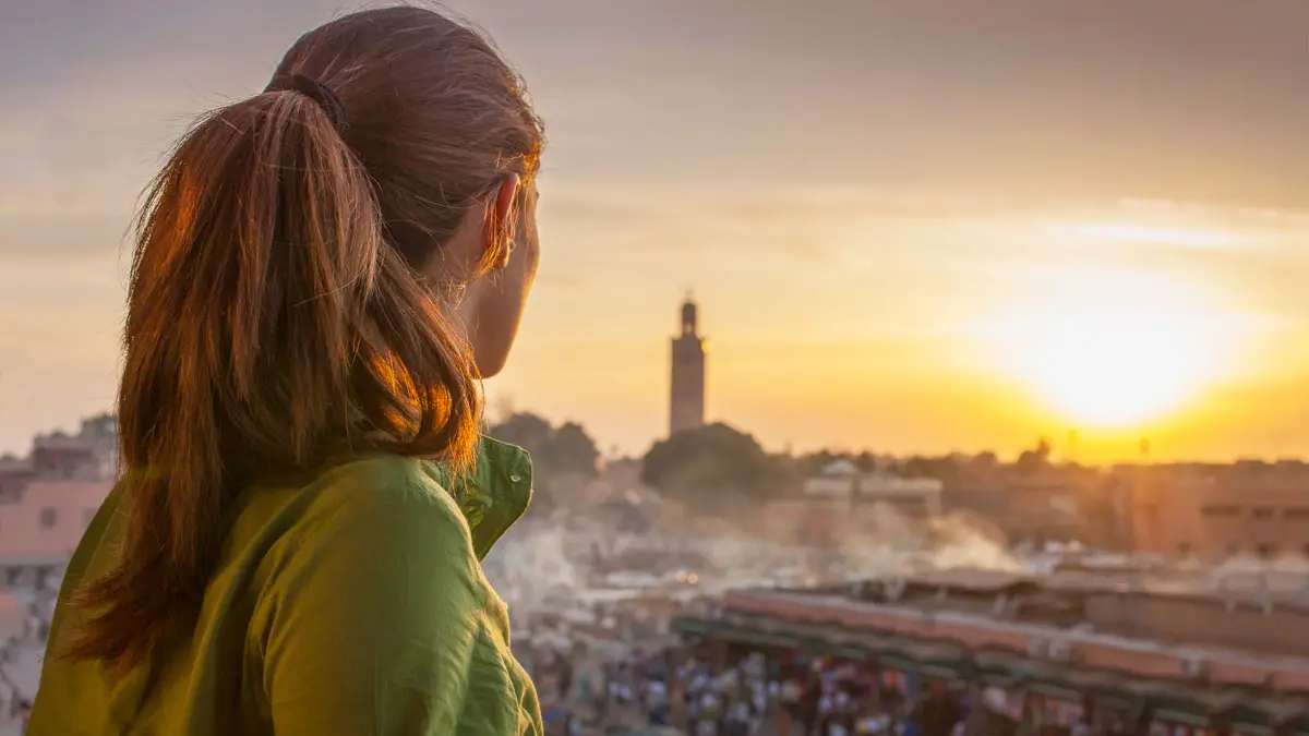 Travel to Marrakech I All You Need women looking at jamaa el fna in marrakech