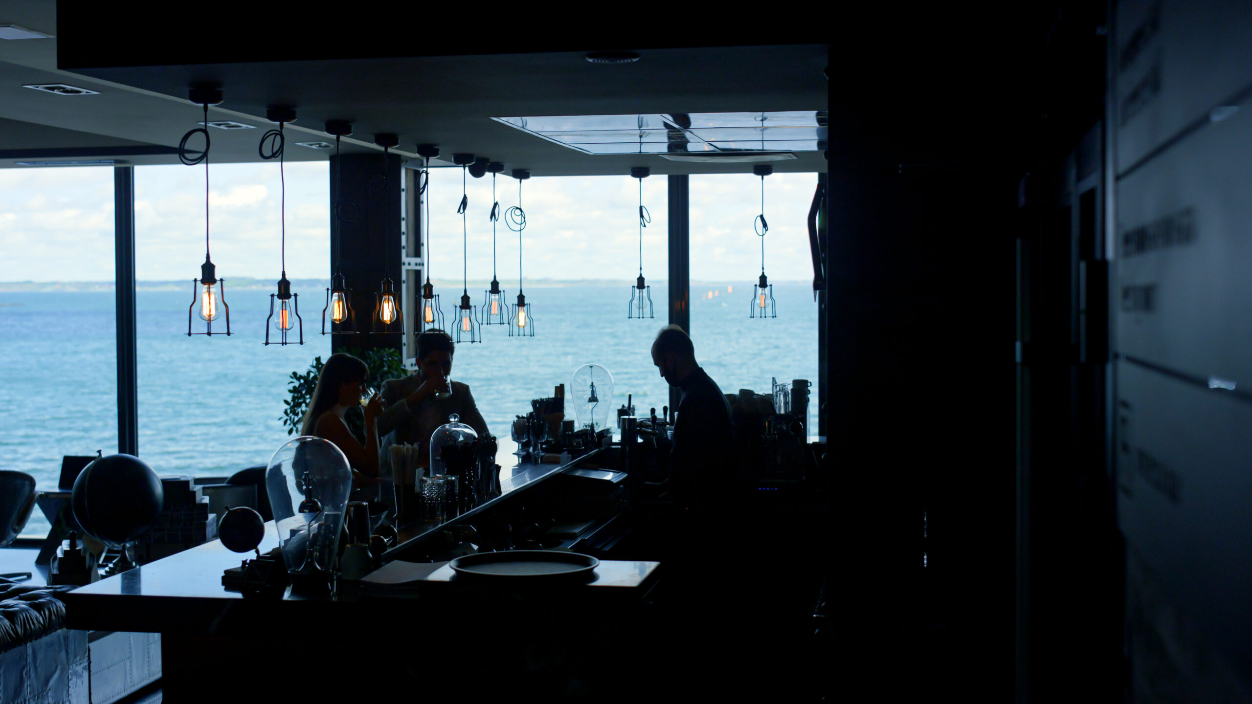 Perfect Day in Casablanca - Beach Day Couple silhouettes drinking cocktails with ocean view at sunset in Casablanca